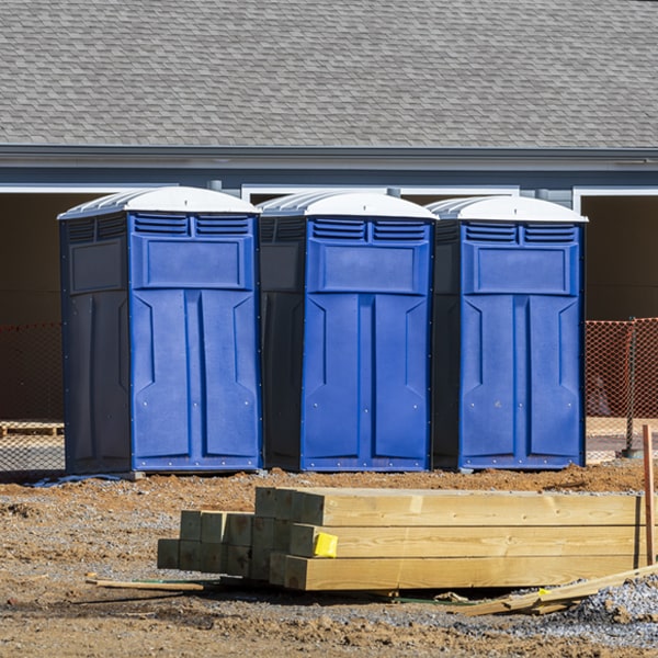 what is the cost difference between standard and deluxe portable restroom rentals in Cortlandville NY